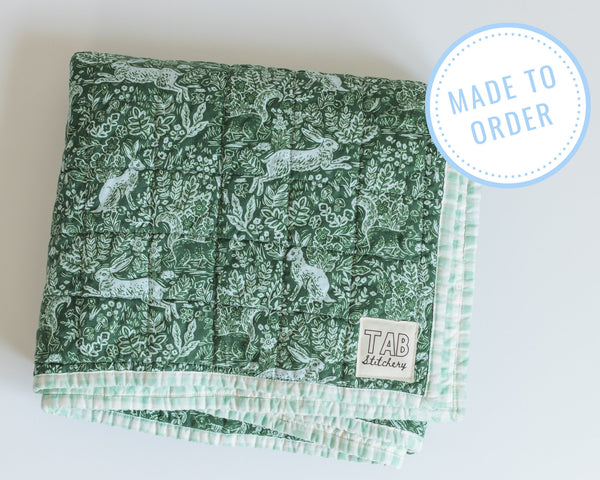 Modern heirloom baby quilt, baby shower gift for boy, Rifle Paper Co wholecloth quilt, woodland rabbits and green gingham crib blanket